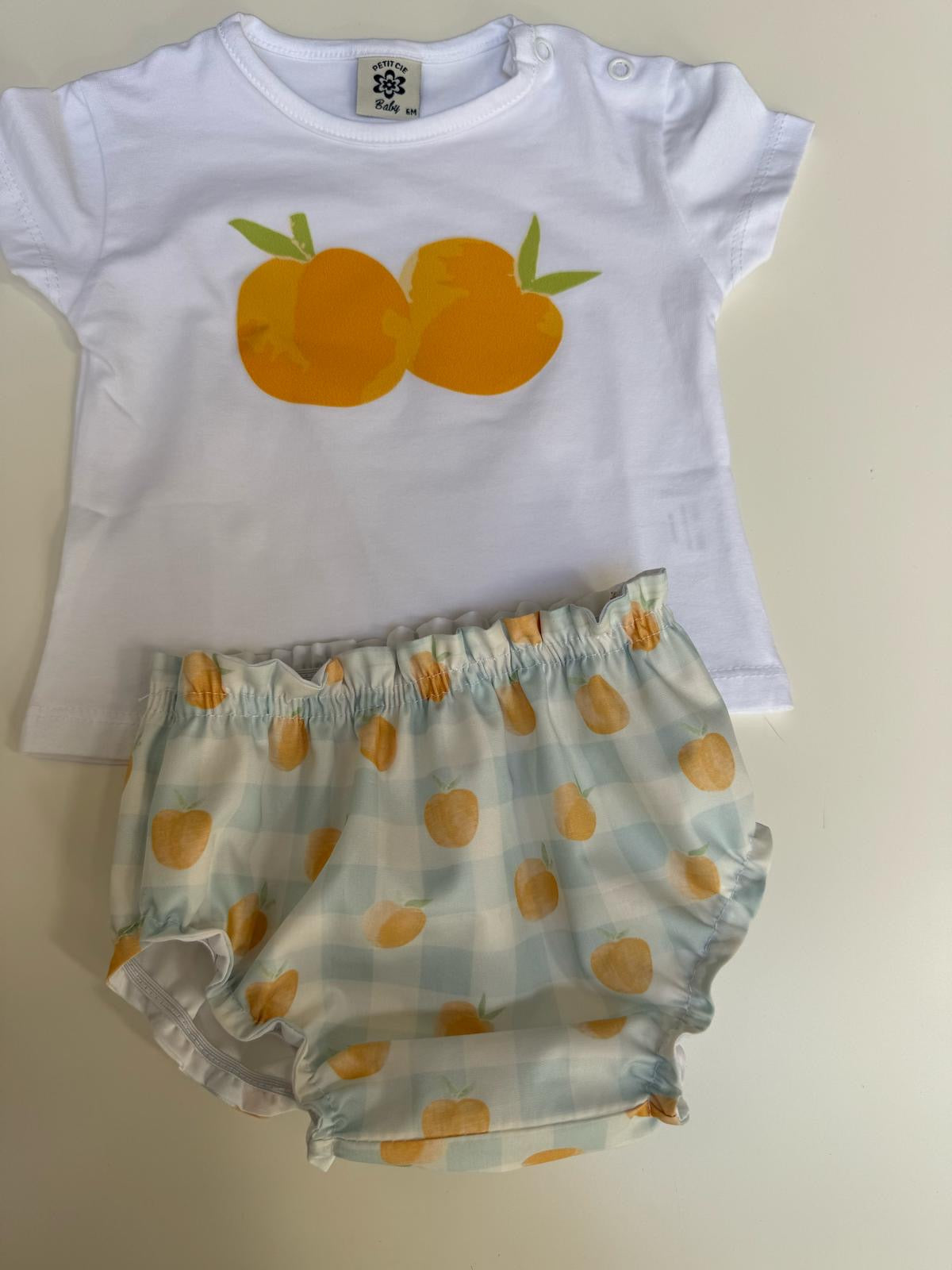 Camiseta blanca naranja