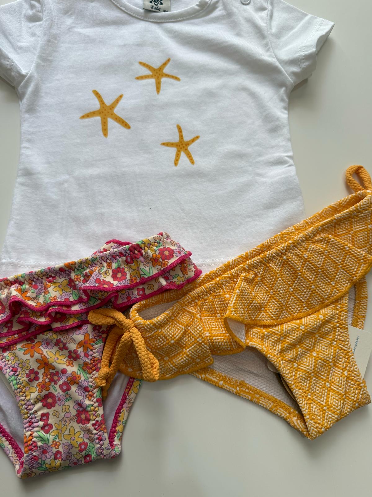 Camiseta blanca estrellas de mar naranjas