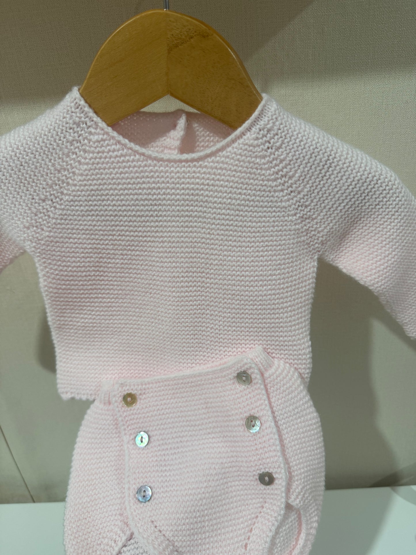 Jersey de punto rosa bebé